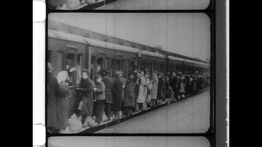 1961 Berlin, Germany. Overcrowded trains carry East Germany Refugees to West Berlin shortly before the constuction of the Berlin Wall. 4K Overscan of Archival 16mm Film Print