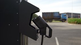 Electric car charging station with nature polluting large truck in background - Powered by Shutterstock - Get 15% off with code: PIKWIZARD15