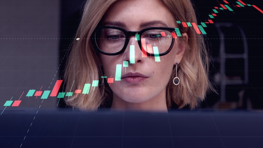 Portrait of attractive blond woman in glasses working on laptop to research financial markets. A businesswoman trader analyzing stock market rates to make the best investment solution. 4k, real time | Shutterstock HD Video #1071100900