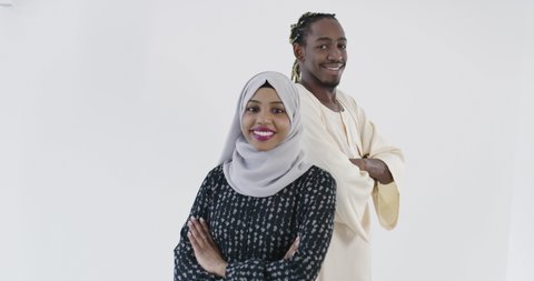 Portrait of black Muslim couple over white background