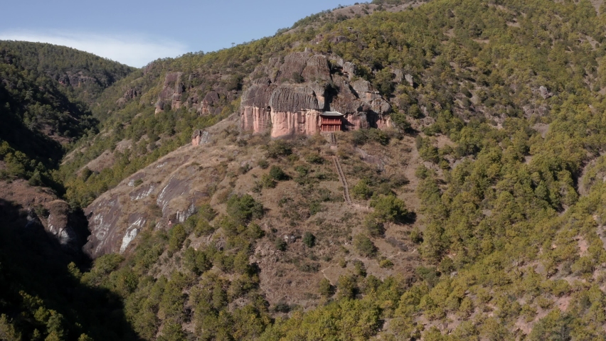Buddhist monastery on Chinese mountain cliffside, Yunnan China, aerial view