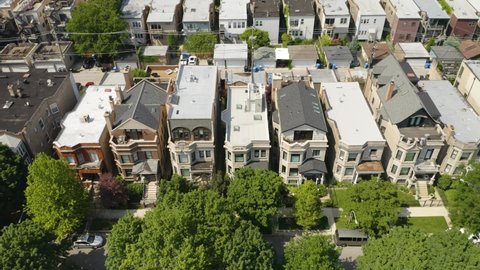 Beautiful Brick and Stone Homes in Urban American City. Wealthy Neighborhood in United States. Aerial Pedestal Down.