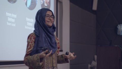 Young excited Muslim female entrepreneur during the pitch session. Karachi, Pakistan. 15th Dec 2018