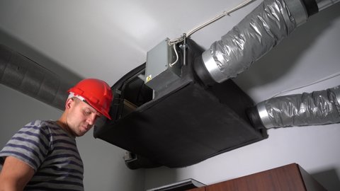 Professional Guy Install Filter for Home Central Air Recuperation System
