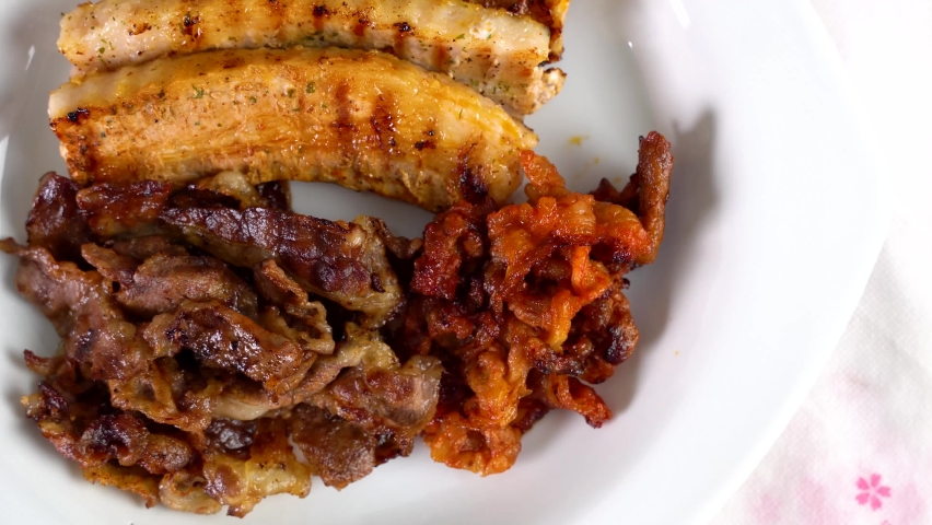 a set of grilled pork belly and marinated thinly sliced beef