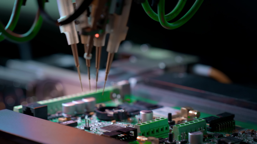 Machine for automatic testing of electronic boards. Manufacturing of microcircuits and microprocessors. Transistors are installed on a green board. The needles touch the microcircuit. | Shutterstock HD Video #1071140056