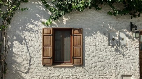 Footage of traditional, old historical house in famous, touristic Aegean town called "Sigacik". It is a village of Seferihisar district of Izmir, Turkey. It is a sunny summer day.
