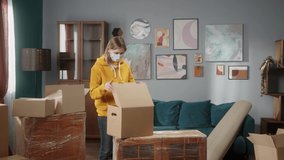 Moving to new flat or office. Customer paying to delivery man using NFC technology with phone and credit card, contactless payment with student girl to professional mover. Cell phone.Daylight  - Powered by Shutterstock - Get 15% off with code: PIKWIZARD15