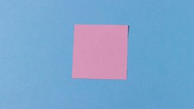Pink origami butterfly folds out of paper and flies away. On a blue background. Education, pastime, hobbies, activities with children - Powered by Shutterstock - Get 15% off with code: PIKWIZARD15