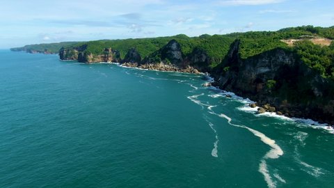 Picturesque coastal cliffs on tropical Java Island, Indonesia, aerial view