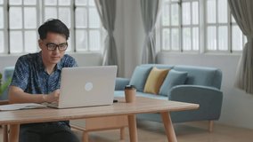 Man Waving Hand During Video Call On Laptop Computer At Home, Video In 4K
