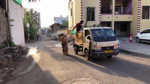 Pune, India - April 23 2021: A trash collection vehicle of the Pune Municipal Corporation with loudspeakers urging people to keep the city clean at village Kharadi, Pune India.