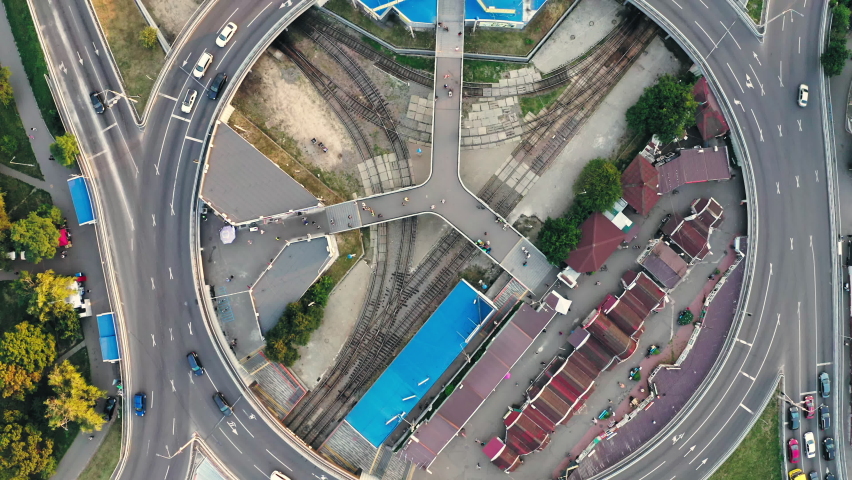 Traffic on the ring road with traffic lights on a summer day, top view drone shot. Traffic on the ring road - top view aerial shot.