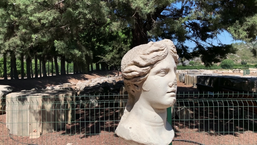Footage of a woman statue at ancient Greek sanctuary on the coast of Ionia called "Claros". The ruins are found north of the town Ahmetbeyli in the Menderes district of Izmir Province, Turkey.