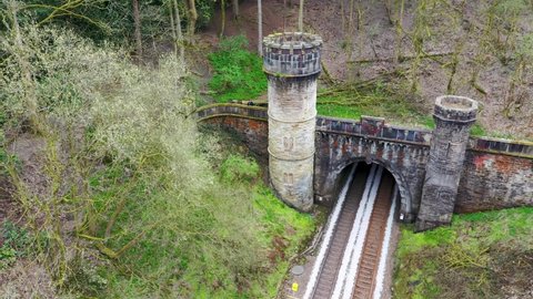 The famous Bramhope Tunnel North Portal, aerial footage Gothic castle-like portal and railway tunnel from above on the Harrogate Line between Horsforth station and Arthington Viaduct in West Yorkshire
