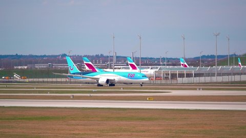 MUNICH, GERMANY - Mar 27, 2021: TUI aircraft at Munich Airport  Due to the coronavirus, only very limited travel and vacations is possible due to restrictions 