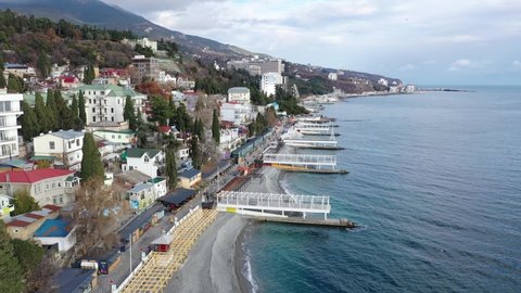 Yalta. Crimea. Winter 2020. Yalta samostroy from the embankment side. Coastal houses of the southern resort. The most well-maintained embankment of Yalta for 2020.
