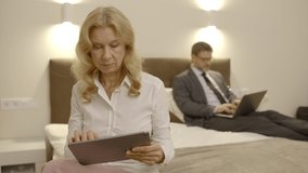 Company colleagues working online in hotel, business trip, modern technology - Powered by Shutterstock - Get 15% off with code: PIKWIZARD15