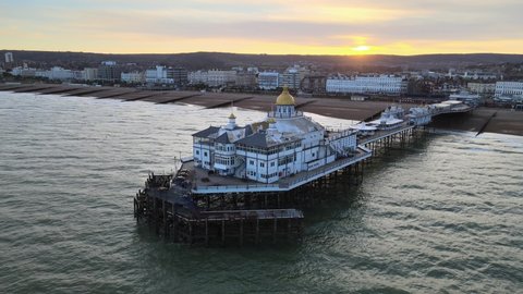 Eastbourne Pier and seafront at Sunset Sussex Uk Aerial view 4K