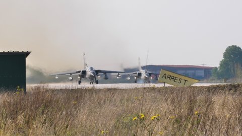 Andravida Greece APRIL, 03, 2019 Jet fighter bomber airplane takes off with tanks and bombs under the wings. Panavia Tornado IDS, interdictor or strike, of Italian Air Force taxiing