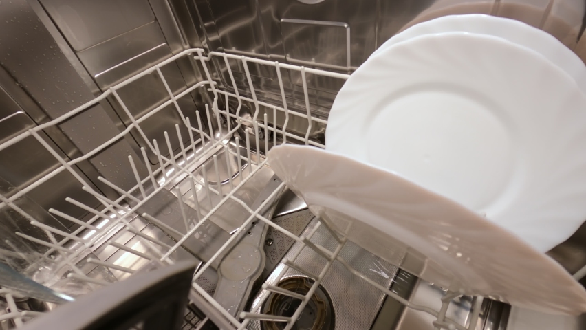 Rinsing plates in the dishwasher in standard mode. A powerful stream of water passes through the dishwasher basket. Close-up. 4k footage. | Shutterstock HD Video #1071262225