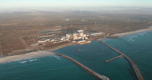 A nuclear power plant at South Africa Cape town coast line with beautiful blue ocean. Aerial view.