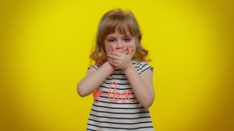 I will not say anyone! Funny little blonde teen kid child girl closing her mouth with hand, looking intimidated scared at camera, gestures no, refusing to tell terrible secret, unbelievable truth