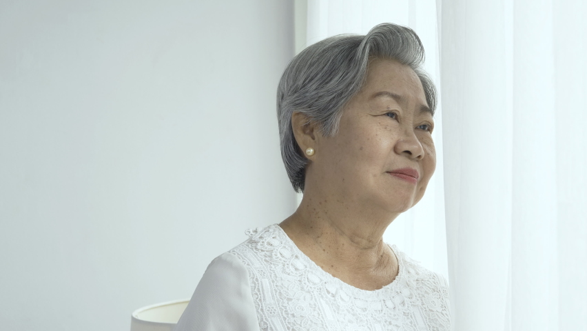 Portrait of senior woman and her daughter with happy emotion at home. Woman go to hug her mother with smiling.