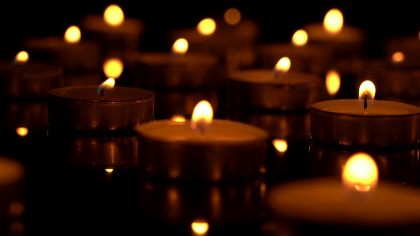 Funeral candles close-up in motion Royalty-Free Stock Footage #1071291484