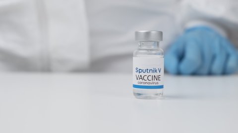 Sputnik V vaccine against Covid-19, coronavirus or SARS-Cov-2 in doctor hand in rubber gloves, March 2021, San Francisco, USA