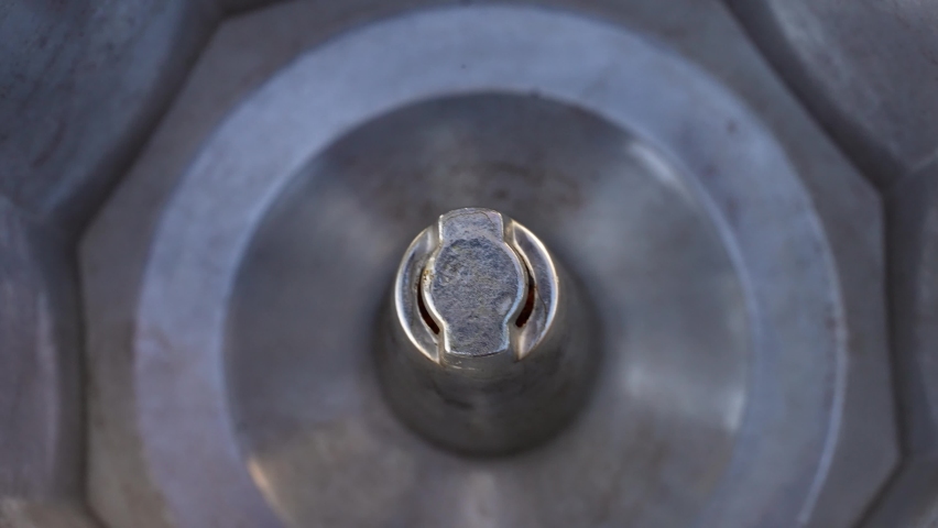 Italian moka coffee maker prepares coffee, top view. moka coffee making process close-up. 4K UHD