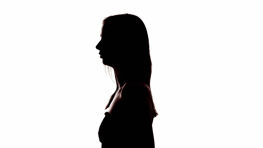 Double exposure silhouette. Music inspiration. Blue glitter mist animation in outline profile portrait of girl enjoying dance listening sound in headphones isolated on white copy space background.