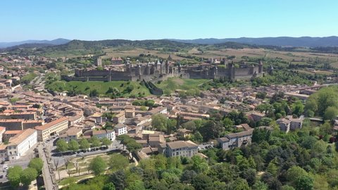 France, Carcassonne, in Cathar country, fortified city, castle of the Counts of Carcassonne and the ramparts, a UNESCO World Heritage site. Wide foreward drone aerial view