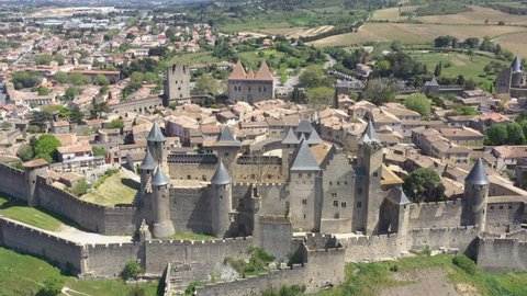 France, Carcassonne, in Cathar country, fortified city, castle of the Counts of Carcassonne and the ramparts, a UNESCO World Heritage site. Left to right close up drone aerial view