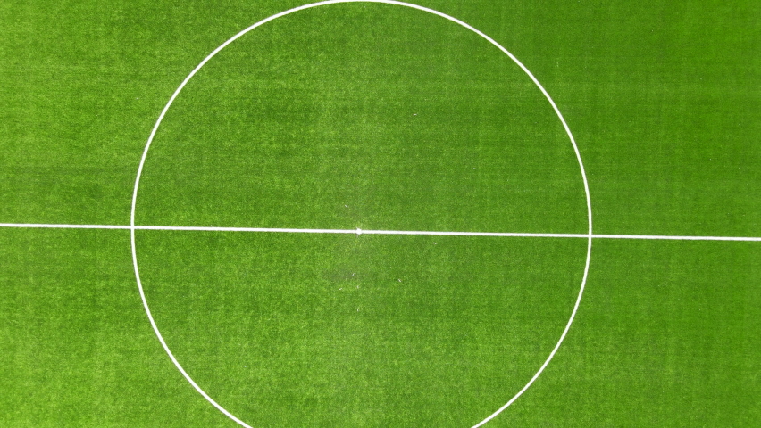 High top down view of center spot on soccer field - slowly zooming out Royalty-Free Stock Footage #1071320059