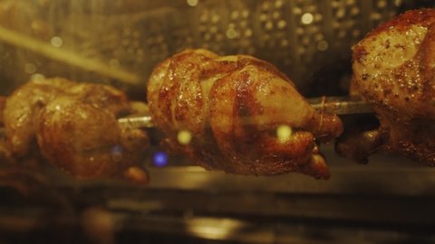 Beautiful Display Of Fresh Rotisserie Chicken Cooking In The Oven - close up shot