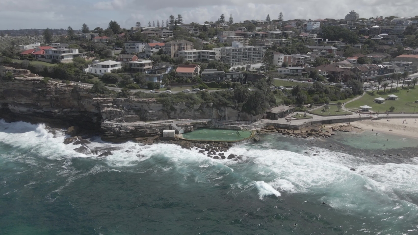 Aerial View Of Bronte Rock Pool With Bronte Residential At The Back In Bronte Beach, Eastern Suburbs, Sydney, New South Wales, Australia - drone shot