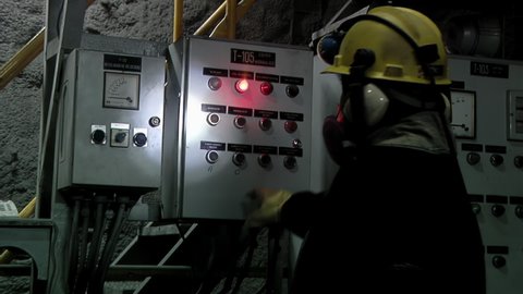 Rio Turbio, Argentina - March 2020: Worker inspecting a Machine inside an Underground Coal Mine in Argentina.