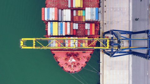 Aerial top view of Cargo operations on container ship in trade port. Business logistic commercial intermodal freight transport in import export, Cargo ship of international at seaports in the World.4k