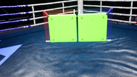 Empty boxing arena with green markered scoreboard or information for tracking 4k footage mocap