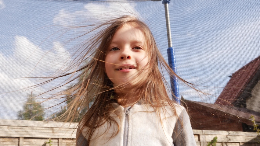 Static electricity - funny kid girl with electrified hair fly up from synthetic clothing Royalty-Free Stock Footage #1071333196