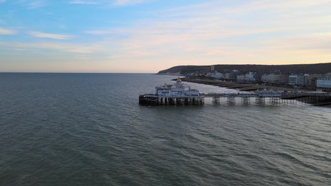 Eastbourne Pier and town at Sunset Sussex Uk Aerial wide POV view 4K
