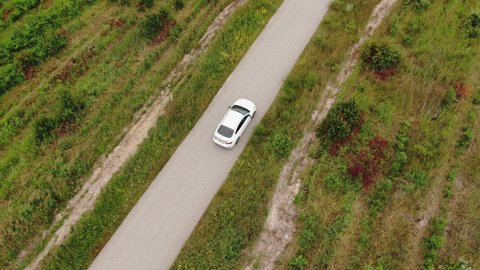 Aerial View of Cars Overtaking on Road