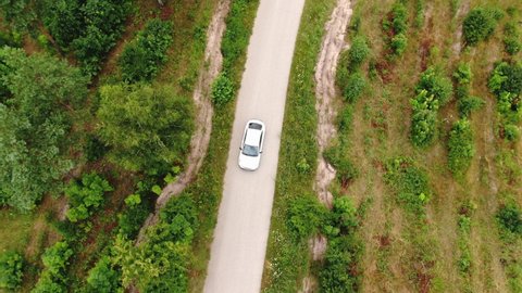 Aerial View of Cars Overtaking on Road