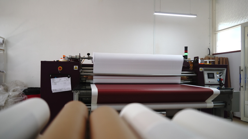 Interior factory Large heat press machine for fabric business in printing room. Sublimation concept.