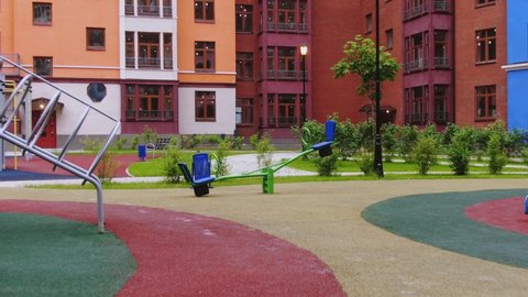Modern playground in apartment courtyard