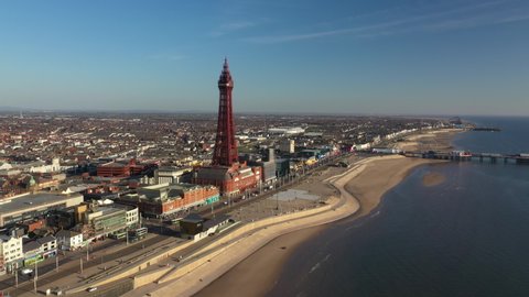 4K: Aerial Drone Video of The Blackpool Tower, England, UK. Circling over the sea towards the landmark. Stock Video Clip Footage