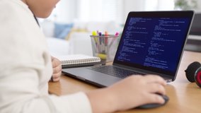 Back rear view of young asia kids boy using computer laptop coding python language programming for big data computer science STEM lesson or tech club in online school remotely learn online school. - Powered by Shutterstock - Get 15% off with code: PIKWIZARD15