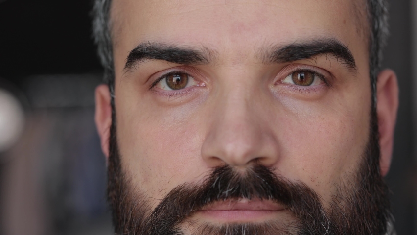 Close up of male face. Attractive man opening his beautiful brown eyes with long eyelashes. Highly detailed portrait of human face. | Shutterstock HD Video #1071361042