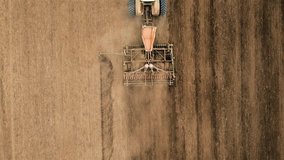 farm tractor sowing field aerial video